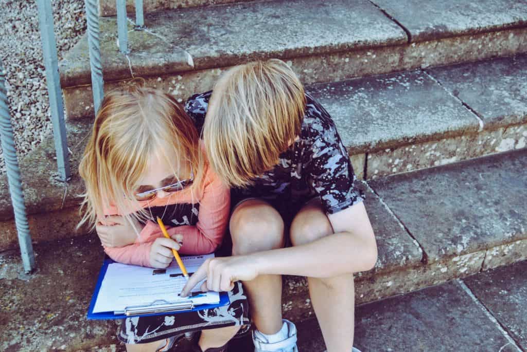 children doing homeschool work together