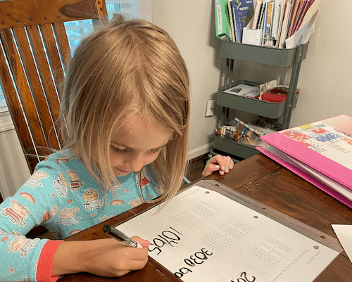 a young girl doing preschool homeschool curriculum math