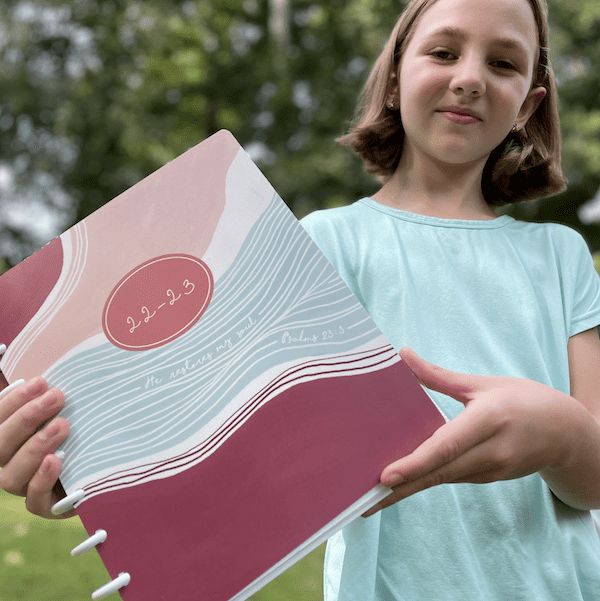 Plum Paper Homeschool teacher planner with girl
