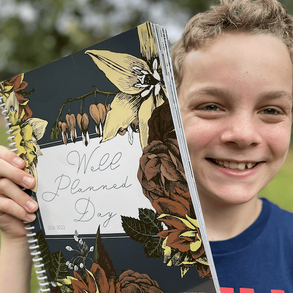 Well Planned Day Homeschool Planner with boy