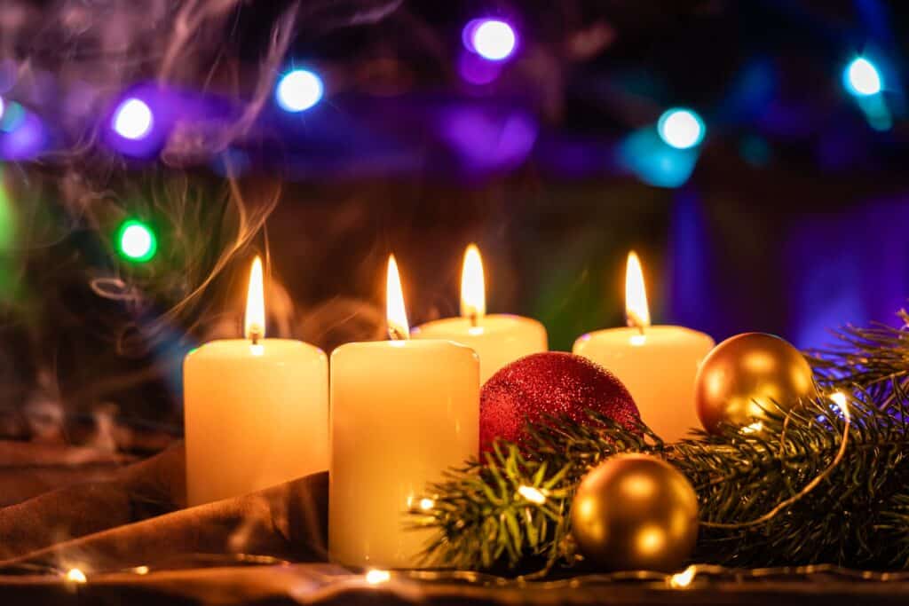 white candles on brown wooden table, what is advent