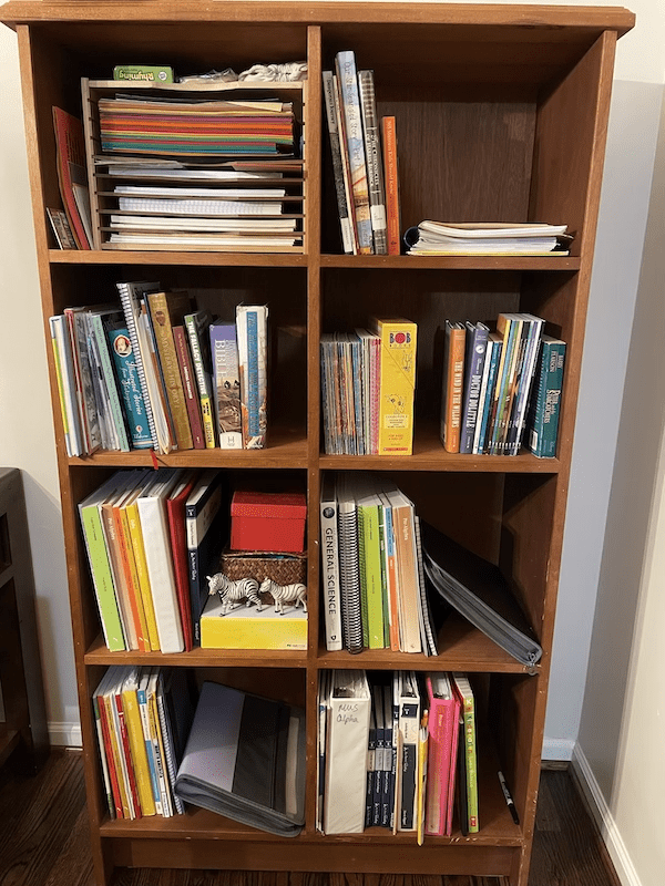 organizing homeschool shelves with books