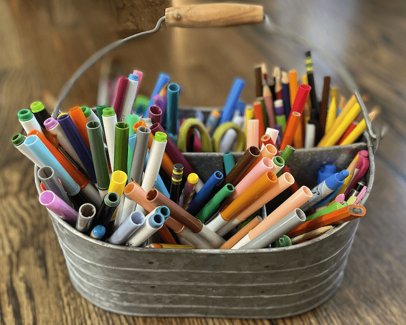 Metal caddy homeschool organizer with markers and pencils