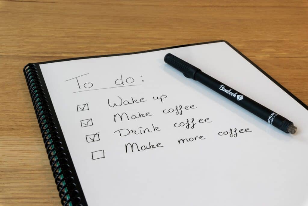 simple to do list on a piece of paper. drink coffee