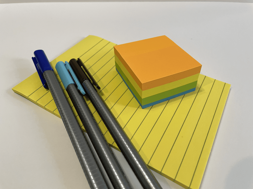 sticky notes and pens to customize your planner