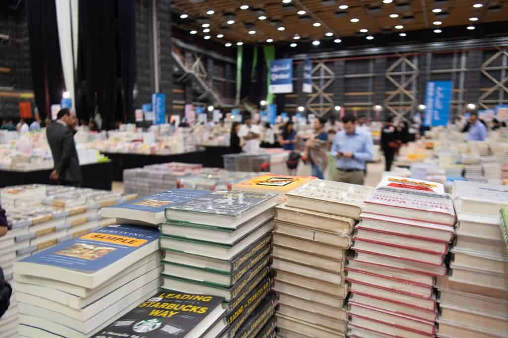 pile of books at a book fair in a homeschool convention