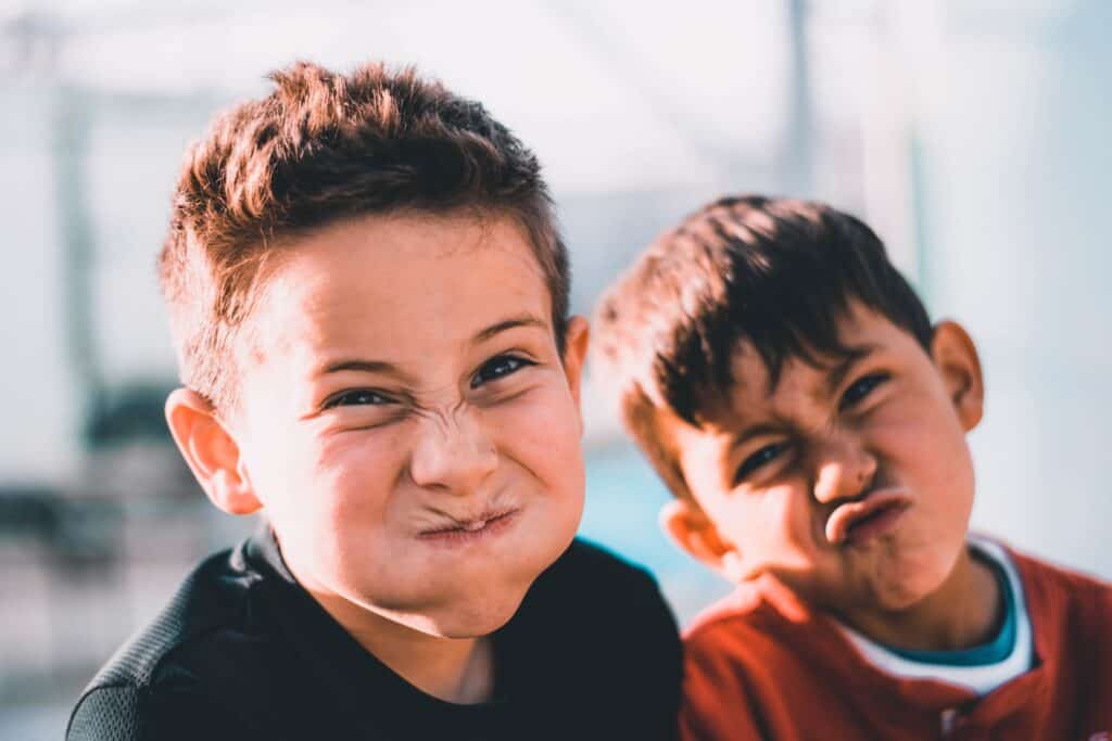 two boys doing wacky faces