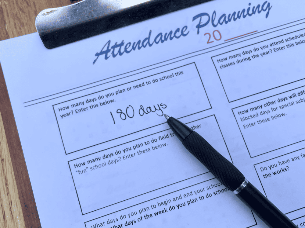 180 days written on attendance planning worksheet with a black pen laying nearby