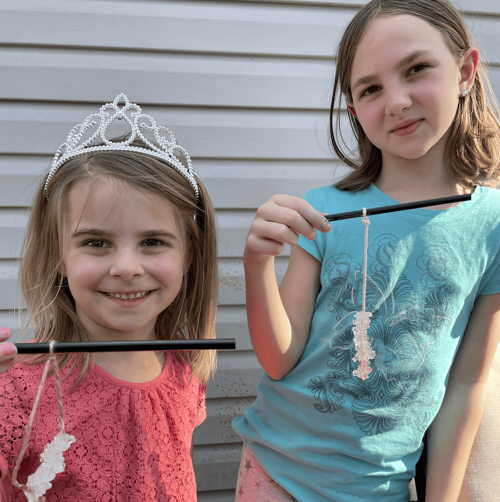 girls holding rock candy for a science project