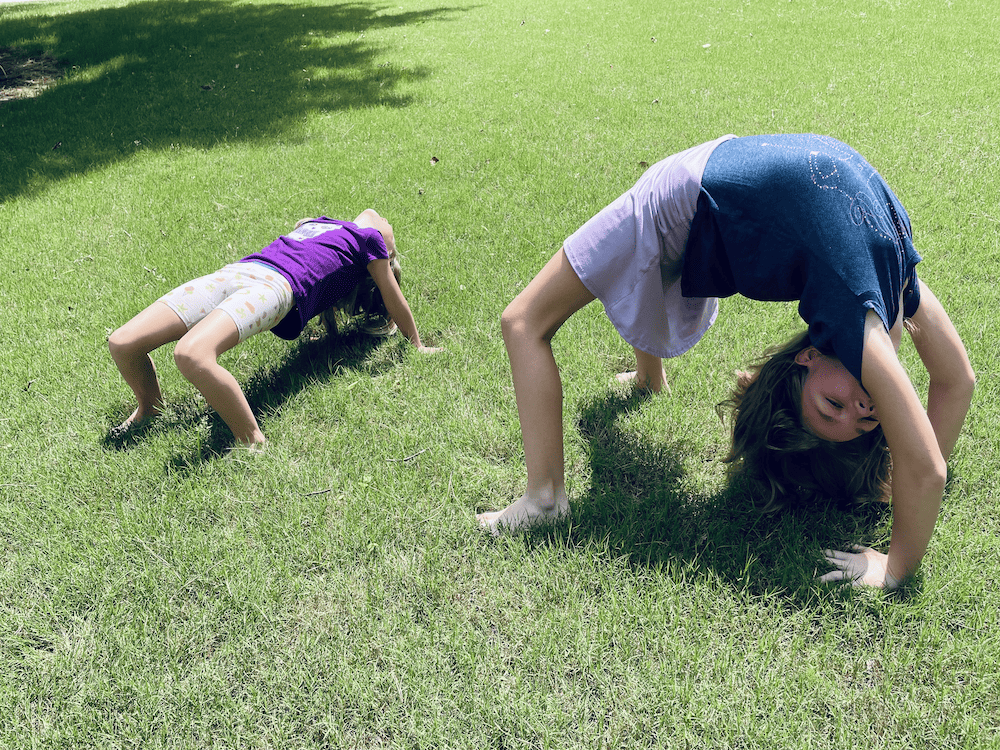2 young girls doing backbends