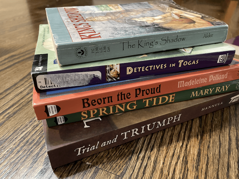 pile of history books for literature-based homeschool curriculum