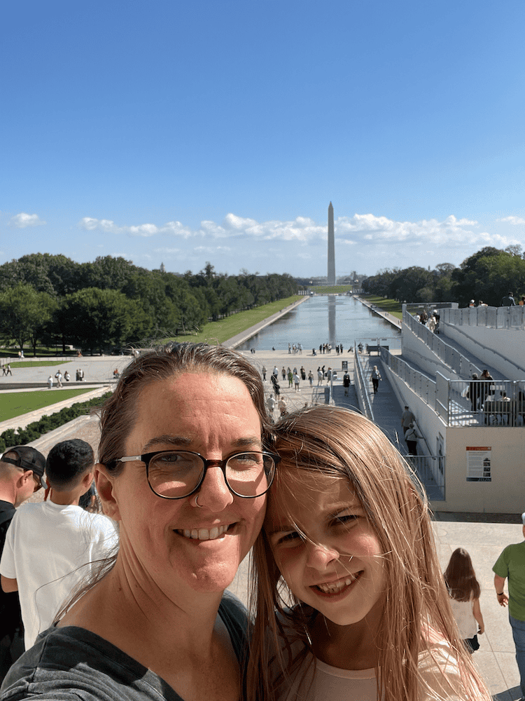 Mom and daughter with the National Mall in the background