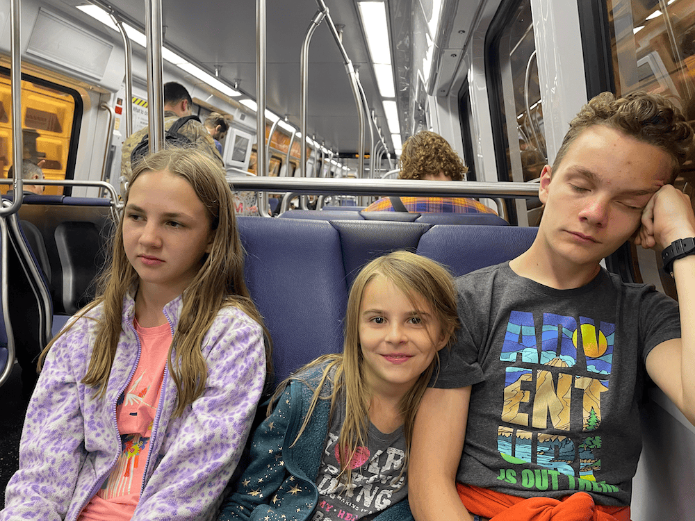 3 tired kids on the metro. Washington DC with kids