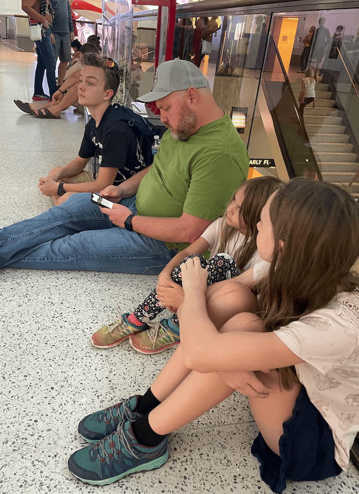 tired family sitting on the floor. Washington DC with kids